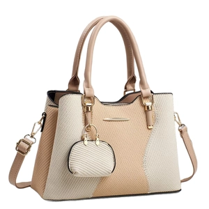 Beige and cream woven minimalist crossbody bag with adjustable strap and mini pouch charm