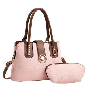 Pink snakeskin embossed tote bag set with brown handles and a small matching pouch
