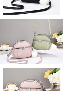 Detailed view of pink, green and black multi-compartment leather crossbody bags