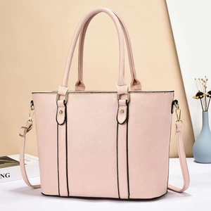 Retro light pink pebbled leather tote bag with gold hardware and adjustable shoulder strap