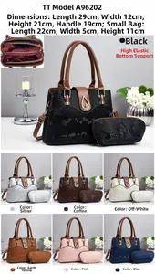 Detail view of stylish faux leather handbag set with snakeskin texture and internal compartments