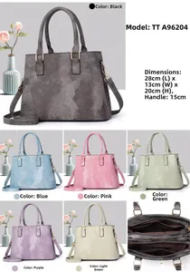 Detail view of stylish tote bag with internal compartments and adjustable shoulder strap