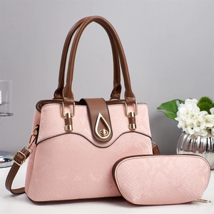 Pink snakeskin pattern tote bag set with brown handles and golden hardware detail