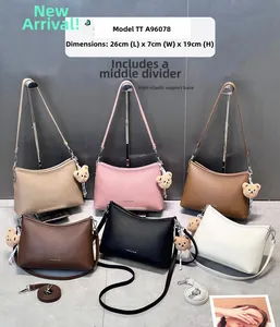 Detailed view of six colors of textured leather hobo bags with size 26x7x19cm and bear charm