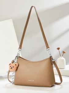 Brown litchi grain PU leather shoulder bag with plush bear charm and long strap