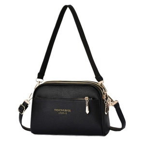 Classic black leather crossbody bag with gold hardware and multiple zipper pockets