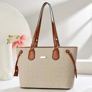 Elegant beige canvas tote bag with V-weave texture and brown leather trim for women