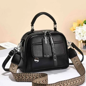 Classic black leather satchel bag with stylish wide patterned shoulder strap and silver zippers