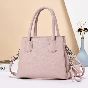 Pink lychee grain leather tote bag with double handles and adjustable crossbody strap