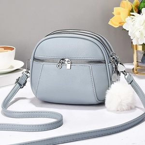 Light blue lychee pattern crossbody bag with multi-layer zippers and heart charms