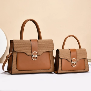Brown leather and beige straw patchwork handbags in two sizes with gold circle buckles