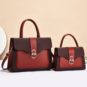 Elegant burgundy leather tote bag set with metal twist lock and woven texture