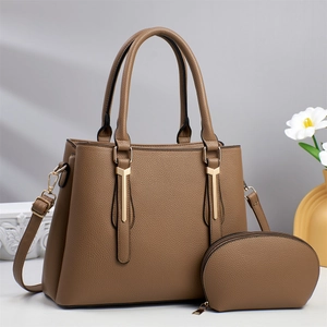 Brown lychee leather tote bag set with golden metal details and matching coin purse