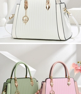Detail of pleated PU leather handbags with gold hardware and ballet dancer charm