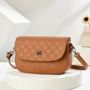 Brown faux leather saddle bag with checkered embossed flap and silver M-shaped metal logo