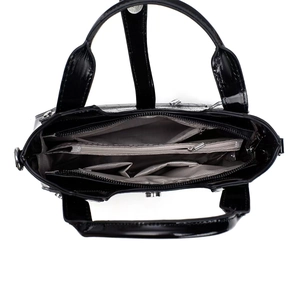 Vue de dessus montrant les compartiments intérieurs multicouches et la doublure du sac à main noir