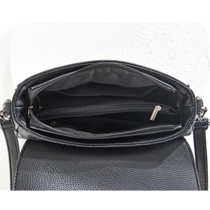 Detail view of the black lychee pattern crossbody bag featuring multiple inner compartments