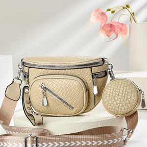 Chic beige textured crossbody bag with matching round coin purse and wide strap