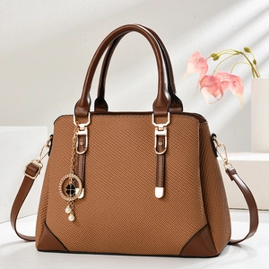 Chic brown patchwork large capacity tote bag with woven texture and gold clover charm