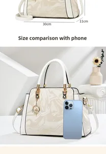 Detailed size view of cream marble tote bag measuring 30cm with gold hardware