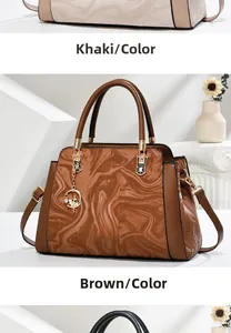 Detail of printed marble texture tote bag with ballerina pendant and adjustable strap