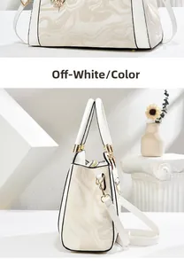 Detail of off-white tote bag with marble pattern, gold hardware and detachable strap
