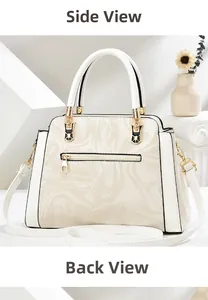 Detail view of the back of this white marble pattern handbag with a gold metal zipper pocket