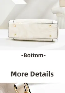 Detailed view of cream marble tote bag base featuring four golden protective metal feet