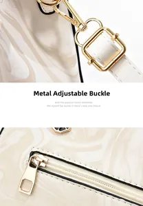 Detail of marble pattern bag with gold metal swivel clasp and smooth zipper hardware