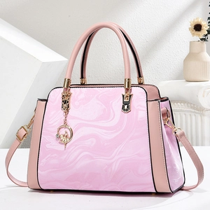 Pink marble pattern handbag for women with dual handles and elegant round pendant