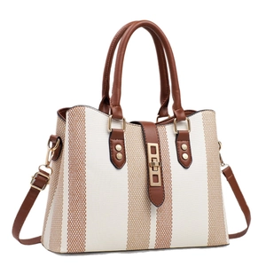 Elegant white canvas tote bag with brown leather trim and stylish vertical stripes