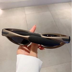 Y2K sporty outdoor wrap sunglasses with metallic bronze frame and dark black lenses