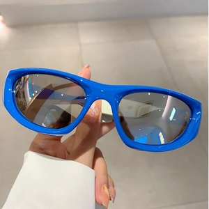 Close-up of blue Y2K sports sunglasses with silver mirrored lenses and futuristic frame