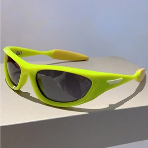 Close-up of fluorescent green Y2K sports sunglasses with yellow non-slip rubber tips