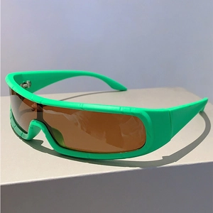 Detail of neon green futuristic sports sunglasses with wrap-around tinted brown lens