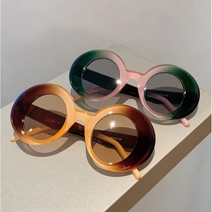 Retro round oversized sunglasses in gradient green and brown frames with UV protection