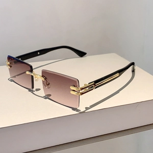 Macro detail of rimless square sunglasses with purple gradient lenses and gold bridge