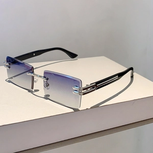 Detailed close-up of rimless metal sunglasses with purple gradient lenses and silver frames