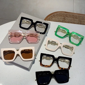Square oversized glasses with thick frames and metal chain temples in multiple colors