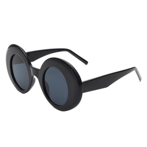 Fashionable oversized round black sunglasses with thick frames and retro aesthetic