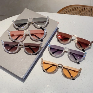 Close-up of semi-rimless sunglasses in five colors with sparkling diamond-encrusted edges
