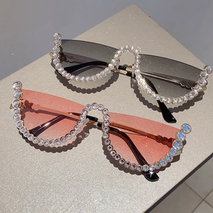 Fashionable rimless wave sunglasses with sparkling rhinestones in grey and pink lens
