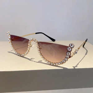 Detail of half-frame gradient sunglasses with rhinestone accents and gold metal temples