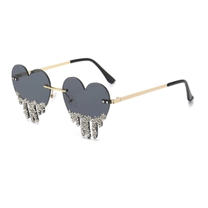 Fashion heart-shaped rimless sunglasses with cascading silver rhinestone drip details