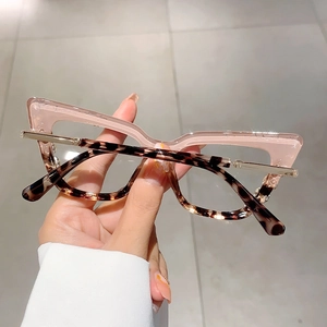 Fashionable pink and tortoiseshell cat-eye glasses with anti-blue light lenses and gold hinges