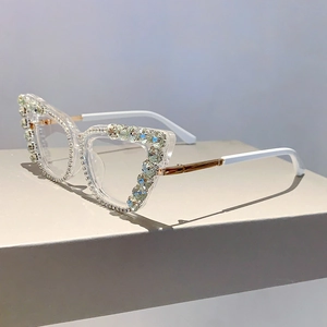 Detailed side view of cat-eye frames with crystal rhinestones and two-tone temples