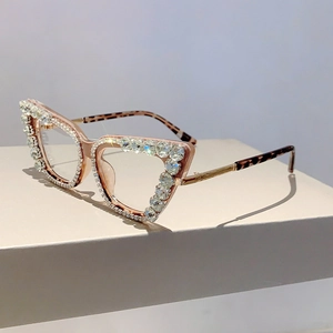 Macro shot of cat eye glasses frames with sparkling crystals and leopard print temples