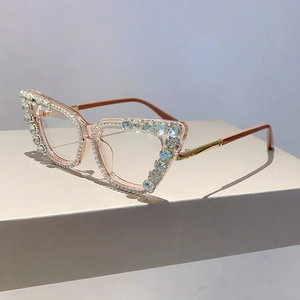 Close-up of cat-eye glasses frame with sparkling rhinestones and metal temples