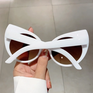 Vintage retro white cat eye sunglasses with gradient brown lenses for a stylish fashion look