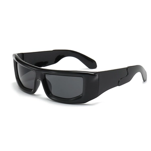 Side view of futuristic Y2K wraparound sunglasses with wide black frames and gray lenses